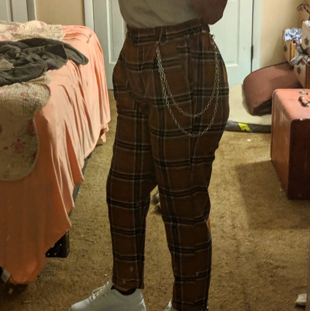 Orange and black plaid trousers